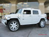 Pimped out ride, Pimp my ride with custom paint. Custom white and chrome large wheels, on a very cool white Hummer.