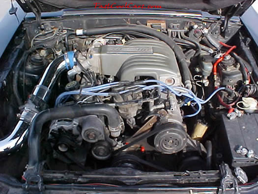 Front view of under the hood of 91' LX coupe 5.0 H.O. - chrome cold air intake with K&N filter, performance wires, underdrive pulley, daily driver