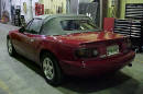 1990 Mazda Miata Roadster right rear angle view with the top up