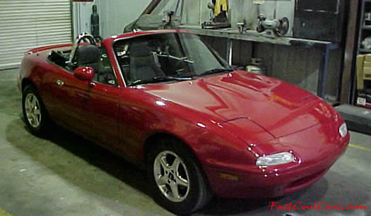 1990 Mazda Miata Roadster right front view with the top down