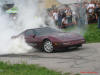 Chevrolet Corvette doing massive burnout.