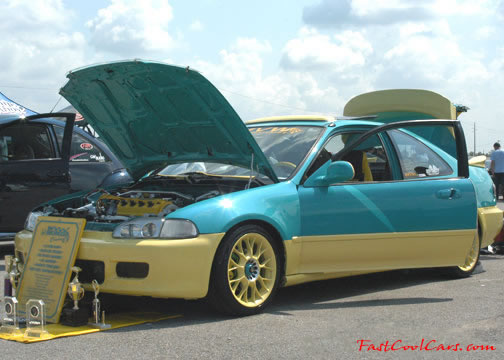 Lowriders that have been lowered, dropped, slammed, and scraping.