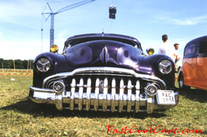 Lowriders that have been lowered, dropped, slammed, and scraping. Classic American lowrider.
