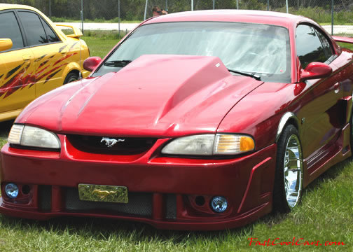 Lowriders that have been lowered, dropped, slammed, and scraping. Classic American Mustang lowrider.