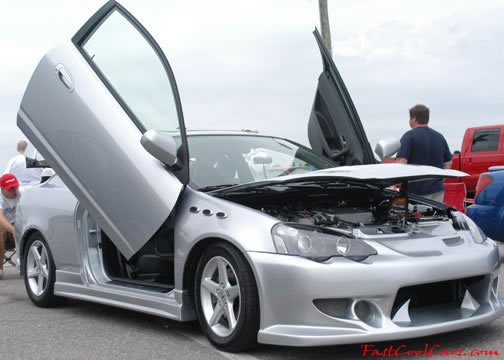 Lowriders that have been lowered, dropped, slammed, and scraping. Nice door modification.